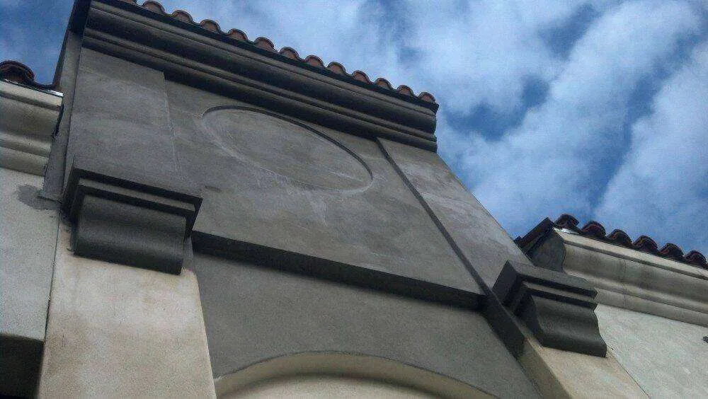 Commercial building facade with decorative foam trim and stucco finish.